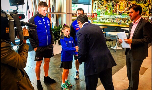 roosAFLWbid300x300.jpg Lacie Harvey presents North's AFLW bid with Jack Ziebell and Brad Scott. Picture: @NMFCOfficial Twitter - ${keywords}